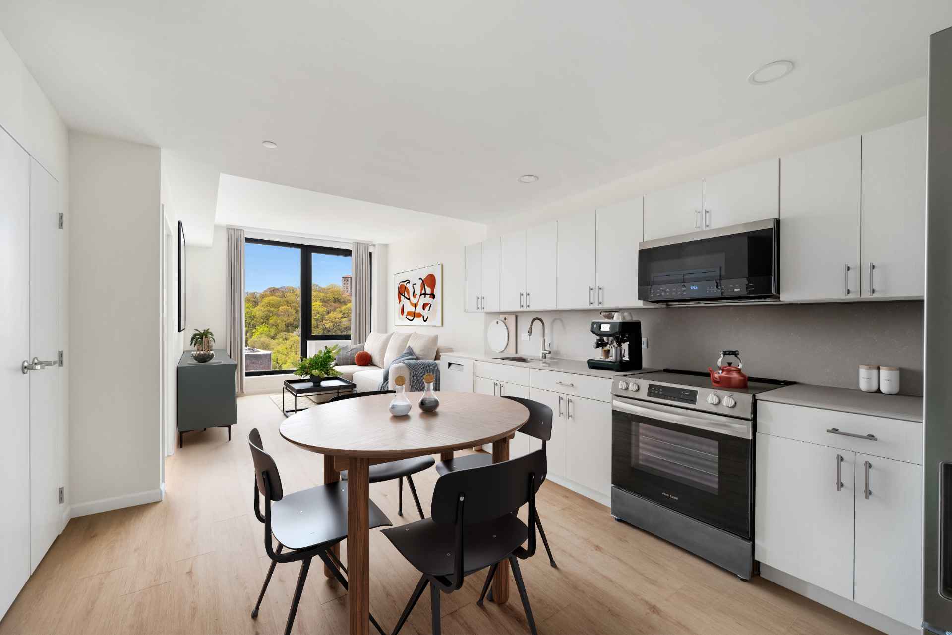 Stylish apartment interior with dining/living area and park views in Inwood apartments at Tryon North.